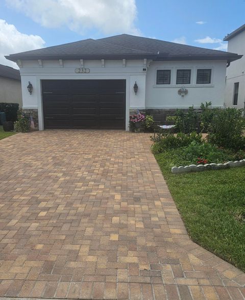 Photo of 232 SE Via Visconti, Port Saint Lucie, FL 34952 (MLS # B26013749)
