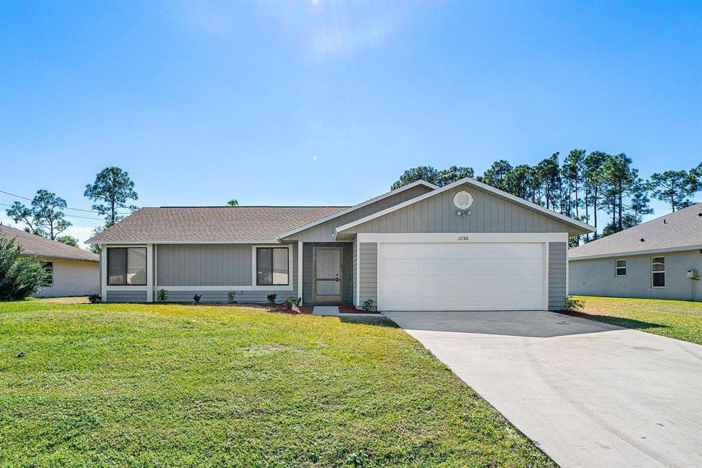 Photo of 1856 SW Millikin Avenue, Port Saint Lucie, FL 34953 (MLS # R10687366)