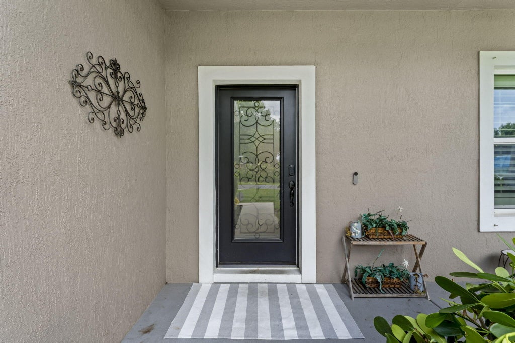 Photo of 2241 SW Abalon Circle, Port Saint Lucie, FL 34953 (MLS # B26045975)