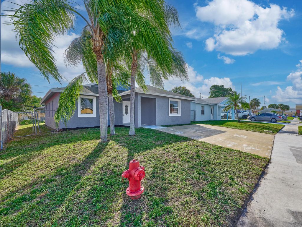 Photo of 1549 W 19th Street, Riviera Beach, FL 33404 (MLS # R11150296)