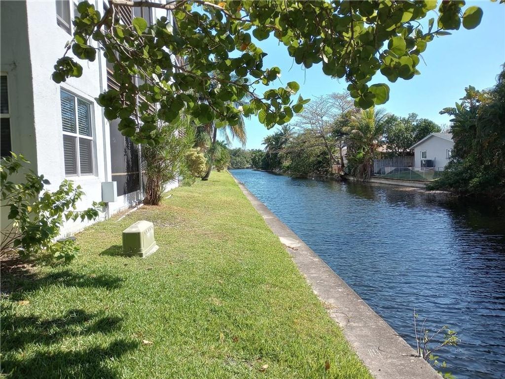 Photo of 111 Royal Park Dr #1H, Oakland Park, FL 33309 (MLS # F10367573)
