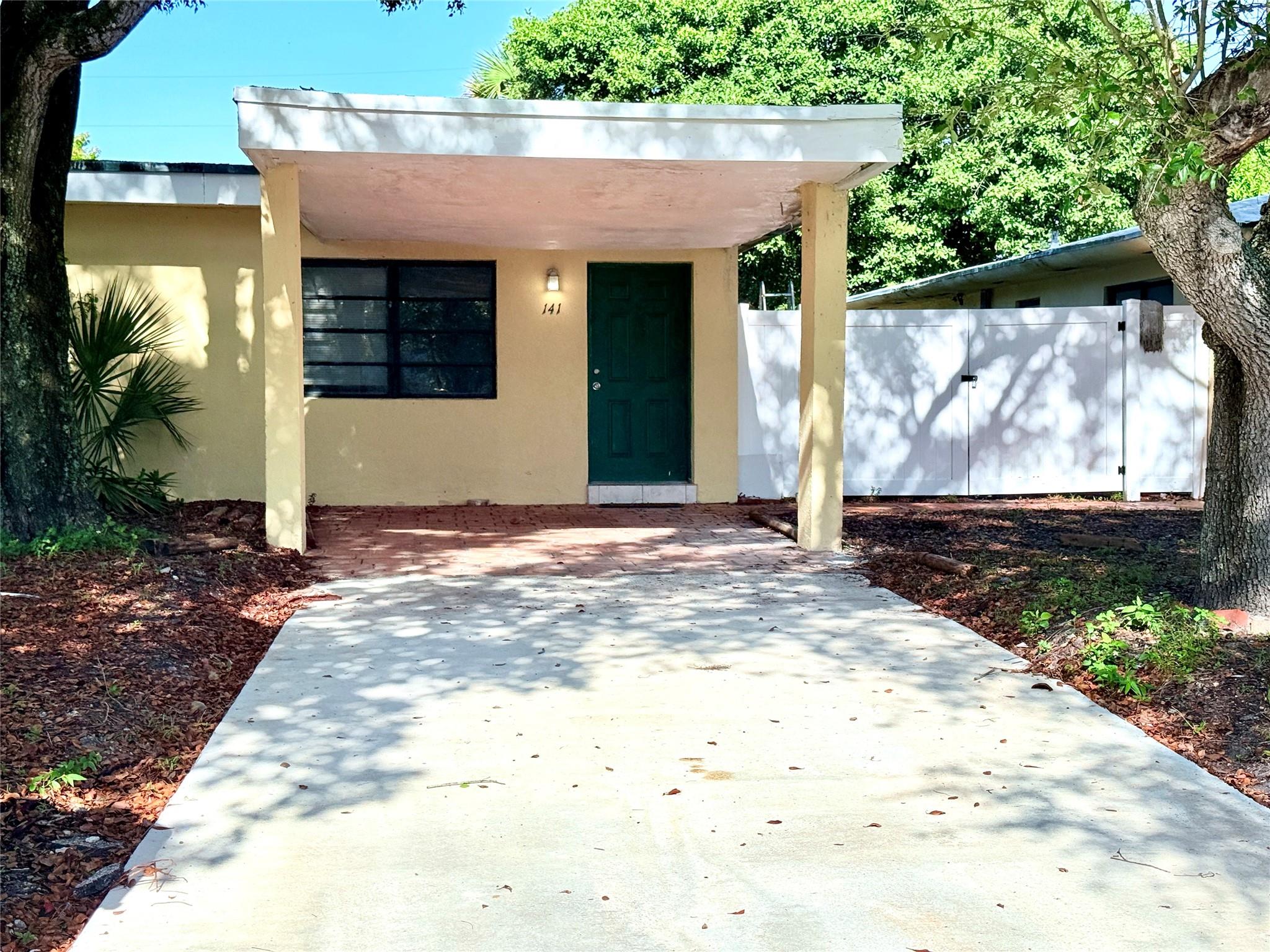 Pet friendly unit with an excellent floor plan available for rent in an up-and-coming area of Fort Lauderdale! Conveniently located near I-95, shops, dining, minutes from downtown, and the beaches. This spacious home features tile flooring throughout, cold central AC, a bright open living area, functional kitchen, and generous bedroom with ample closet space and access to an open back yard under plenty of shade. Your private carport parking protects you from the elements and sits on a driveway long enough to easily accommodate a second car. No HOA screening; very fast approval.