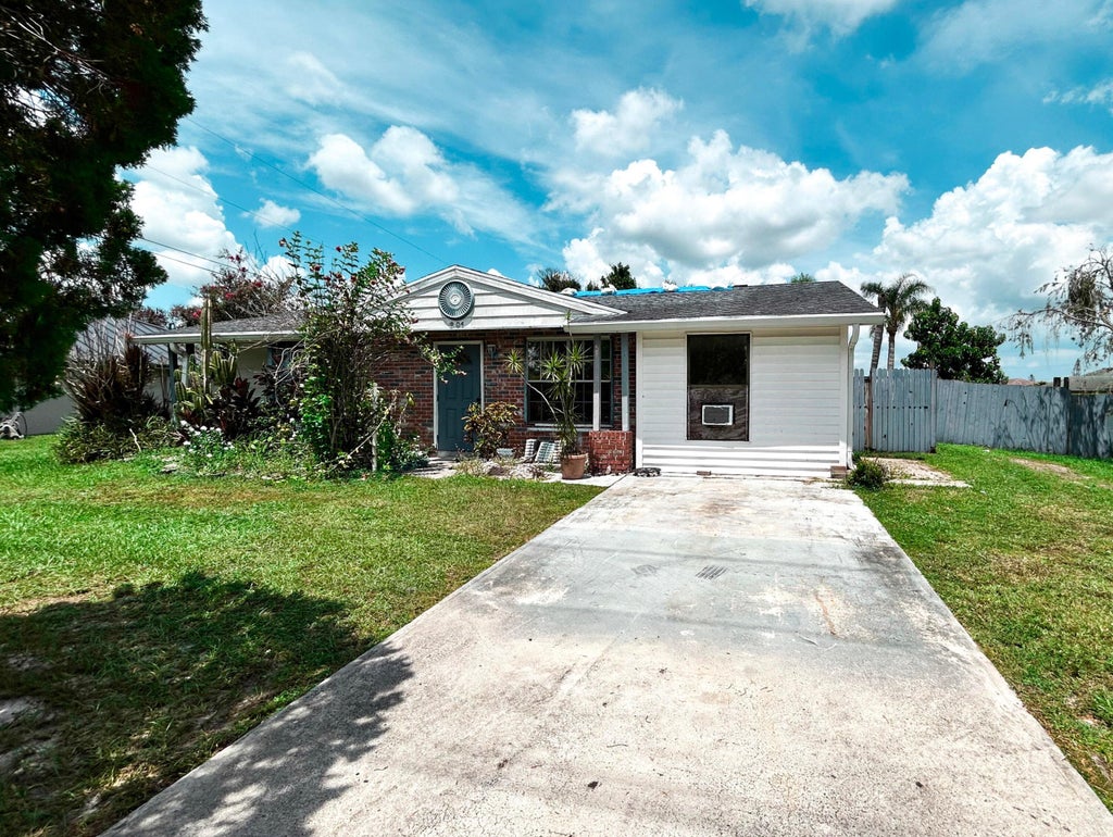 Photo of 201 NW Floresta Drive, Port Saint Lucie, FL 34983 (MLS # B26079469)