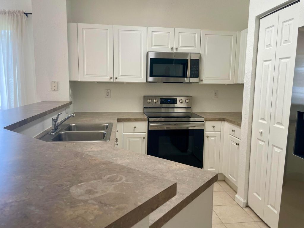 Photo of 4988 SE Mariner Garden Cir, Stuart, FL 34997 (MLS # B26000972)