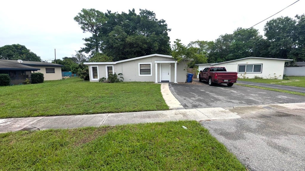 Photo of 1552 NW 15TH Terrace, Fort Lauderdale, FL 33311 (MLS # B26082177)