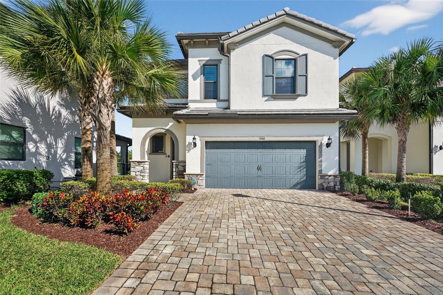 Welcome to 4460 Gramercy Dr on a cul-de-sac in gated Oak Tree, Oakland Park. Built in 2022, this two-story home offers 3 bedrooms, 2.5 baths, and 1,941 sq ft on a 7,665 sq ft lakefront lot with fountain views. Bright open plan with high ceilings, tile floors, and hurricane impact windows and doors. Quartz and stainless kitchen with large island, walk-in pantry, ample cabinet space, and screened patio for sunrise lake views. Upstairs laundry room and spacious loft. Primary suite with a walk-in closet and extra-large glass shower. Two-car garage with ceiling storage and floor cabinets. Resort amenities include a clubhouse bar, gym, pool, pickleball, grills, fire pit, hammock, and sand garden. HOA includes all landscaping and high-speed internet for easy living.