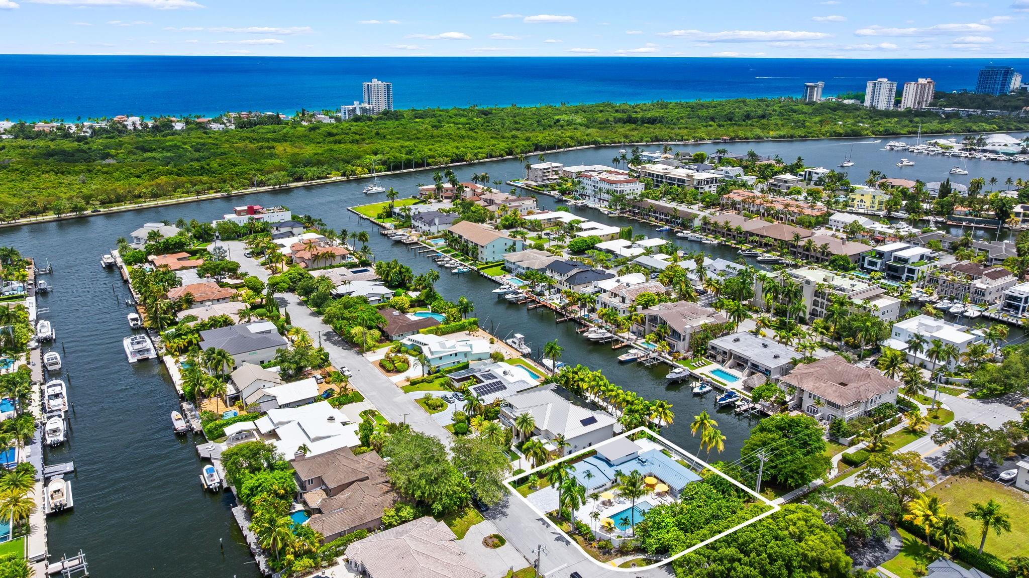 FULLY FURNISHED, BRING YOUR BOAT! Brand-new concrete dock & pier coming soon to this spectacular 4 bedroom, 3 bathroom modern coastal retreat w/ 80 ft of waterfront in one of South Florida’s most prestigious neighborhoods, CORAL RIDGE. Nearly $1M in upgrades: gourtmet kitchen w/ gas stove, terrazzo & tile floors, saltwater heated pool + jacuzzi, travertine patio, lush landscaping & privacy. Split layout between the luxe primary suite & junior suite w/ sleek modern baths. Retractable glass doors open to the poolside patio for indoor-outdoor living, while another opens to the enclosed porch w/ formal dining + lounge area. Oversized 2-car garage, ping pong table, 2 washers & dryers, outdoor shower & storage. Minutes to the beach, shops & downtown, this is more than a rental, it’s a lifestyle!