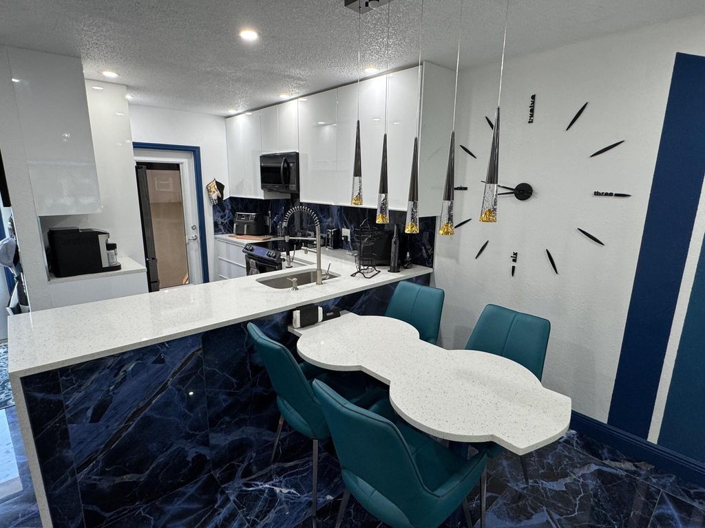 Photo of 5121 W Oakland Park Boulevard #212, Lauderdale Lakes, FL 33313 (MLS # R11110086)