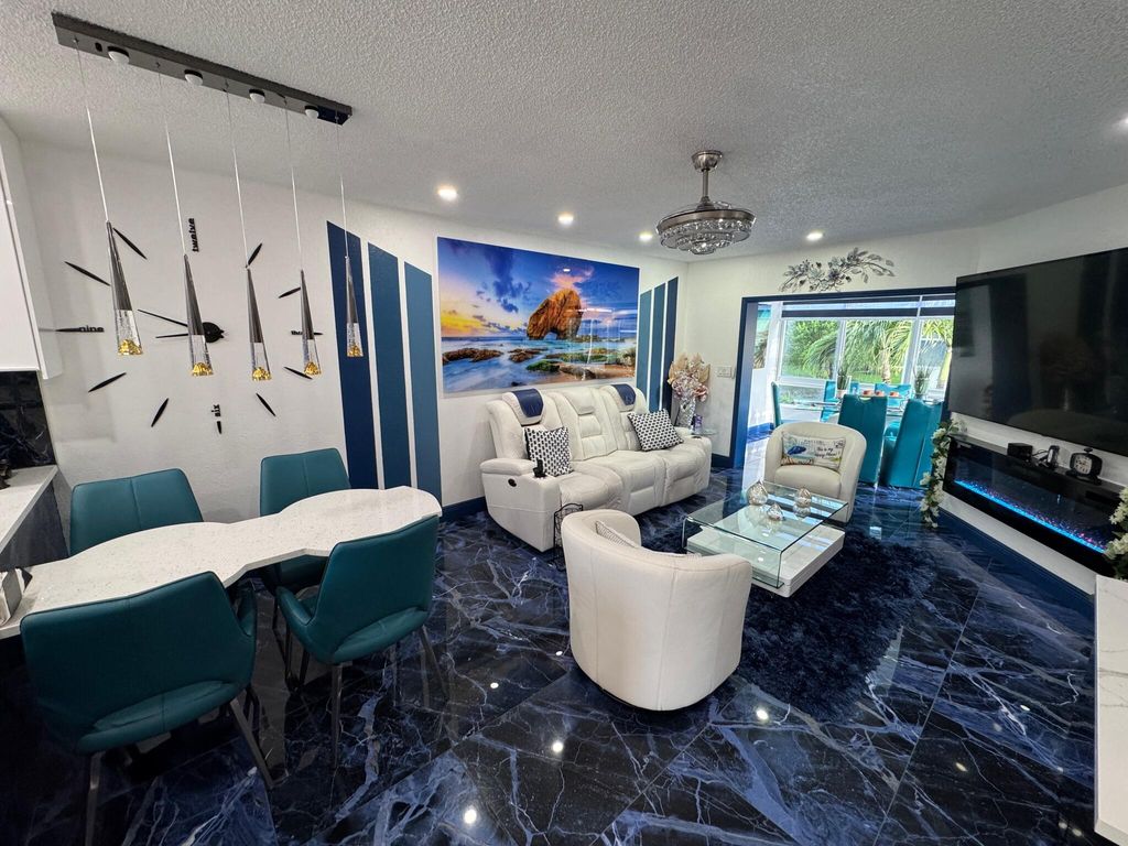 Photo of 5121 W Oakland Park Boulevard #212, Lauderdale Lakes, FL 33313 (MLS # R11110086)