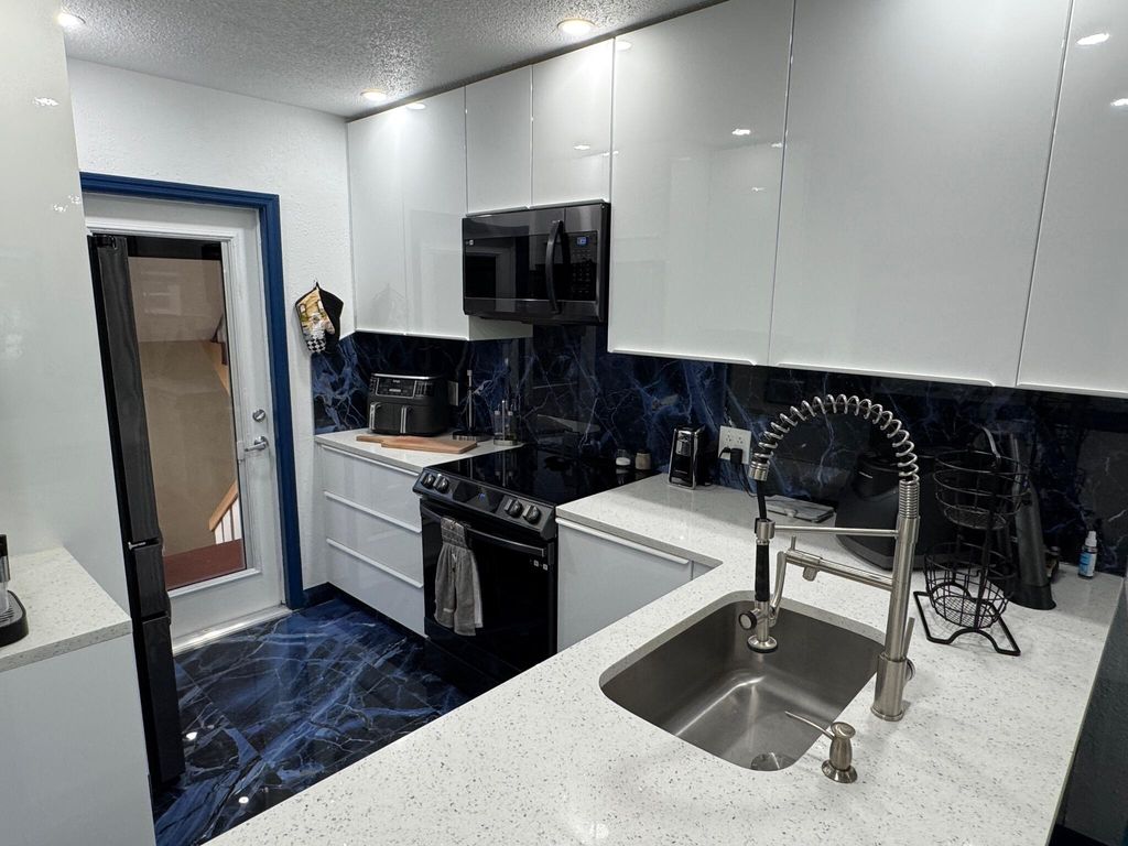 Photo of 5121 W Oakland Park Boulevard #212, Lauderdale Lakes, FL 33313 (MLS # R11110086)