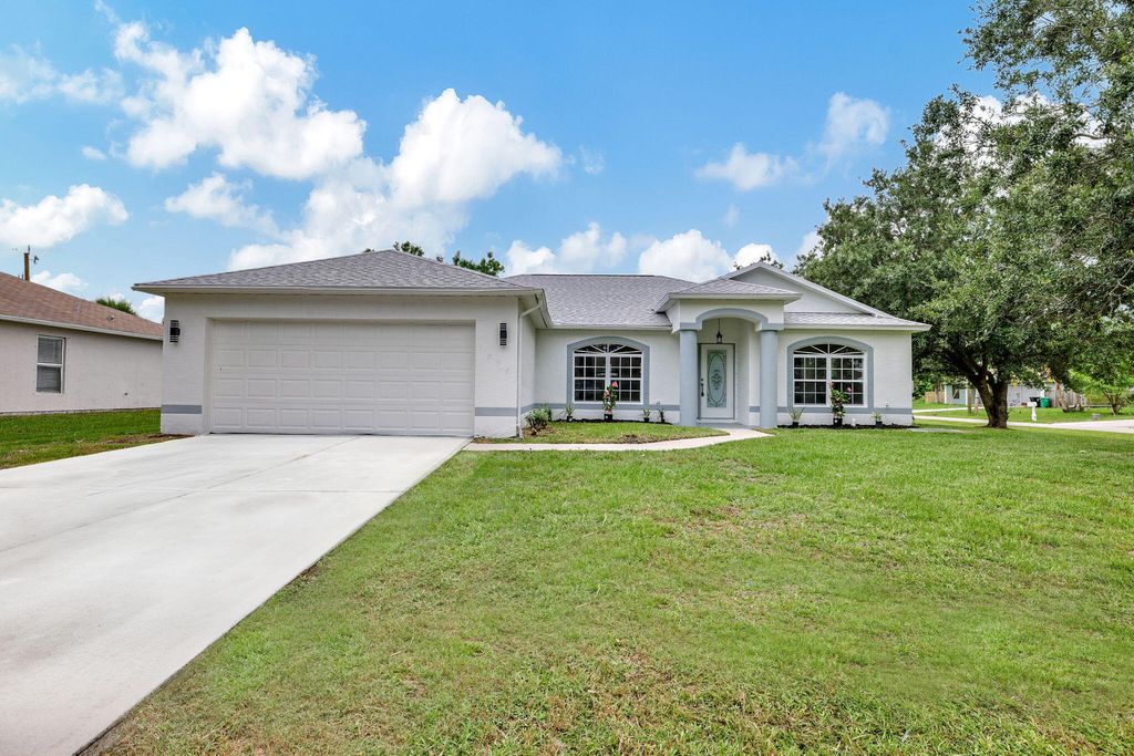 Photo of 1898 SW Effland Avenue, Port Saint Lucie, FL 34953 (MLS # R11004114)