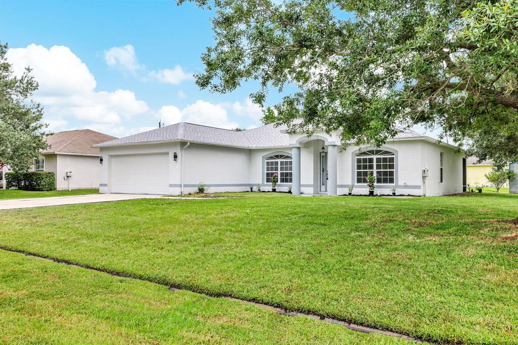 Photo of 1898 SW Effland Avenue, Port Saint Lucie, FL 34953 (MLS # R11004114)