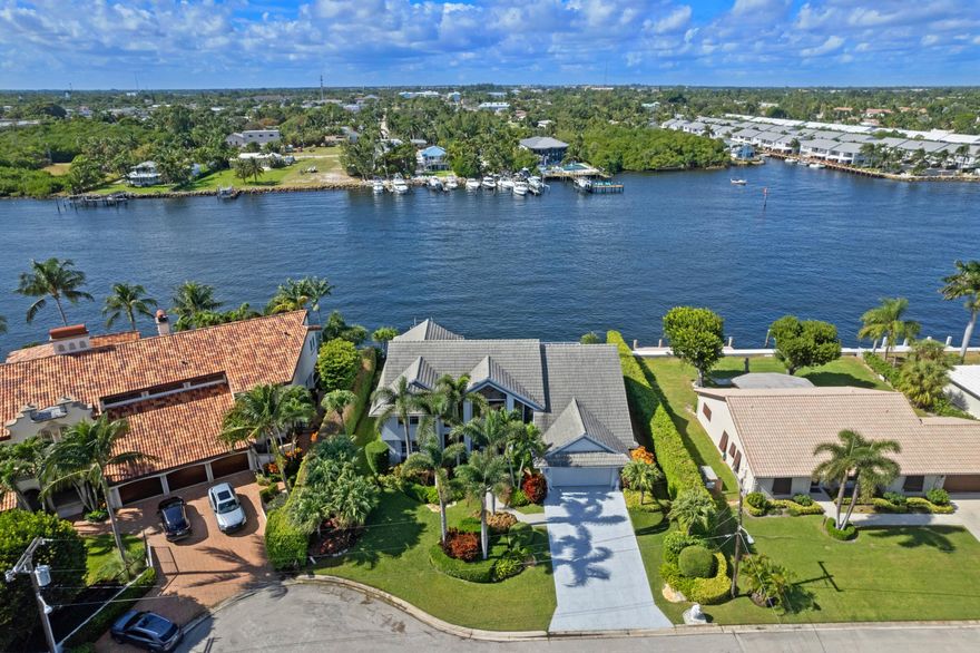 Introducing a spectacular property in Ocean Ridge, this wonderfully maintained direct Intracoastal home offers breathtaking water views from every room. The high ceilings and abundant natural light create a bright and inviting space, while the expansive master suite with a sitting area provides a luxurious retreat. With 3 bedrooms plus a bonus room, including 2 conveniently located on the first floor, this home is perfect for both relaxation and entertainment. Enjoy a short stroll to the nearby beaches and easy access to the Boynton Inlet and Atlantic Ocean for boating enthusiasts. This property boasts 100 feet of water frontage, making it an ideal waterfront oasis. Situated in the exclusive community of Inlet Cay, one of 55 secluded homes, this residence offers privacy and tranquility.