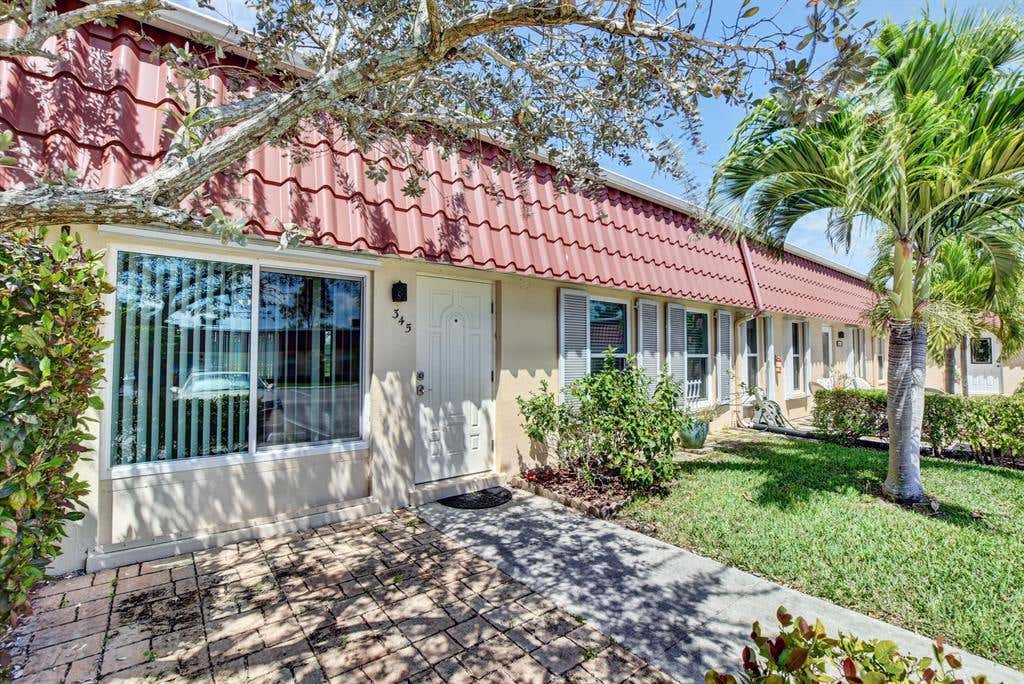 Photo of 345 Covered Bridge Boulevard, Lake Worth, FL 33467 (MLS # R10702365)