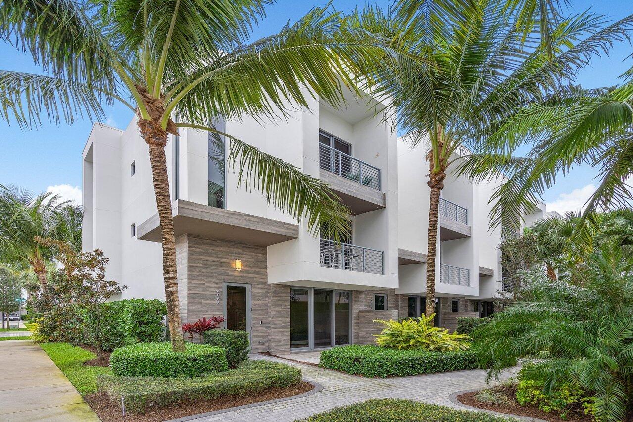 Indulge in the epitome of luxurious living with this exceptional 3-bedroom, 3.1-bath, 2-car garage, 3-story townhouse in the exclusive MODERNE BOCA community. This contemporary corner unit is bathed in natural light, featuring extra windows that complement its sleek lines, high ceilings, and modern design elements. Revel in the sophistication of motorized window shades, custom closet cabinets, mirrors, an accent wall, and a decorative barn door. The expansive living area seamlessly integrates the living room, dining space, and a gourmet kitchen adorned with European-style high-end cabinetry, large islands, quartz countertops, and a built-in garage storage system.MODERNE BOCA offers a unique urban living experience in the heart of Boca Raton, surrounded by the finest amenities.