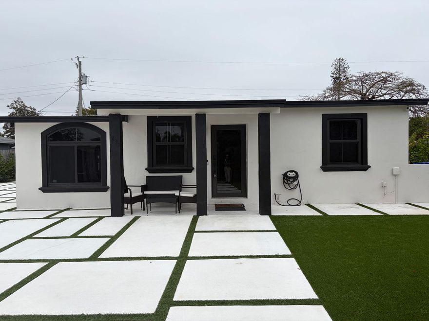 Fully furnished, 3-BD/2-BA luxury retreat in Pompano Beach, now available! Renovated top to bottom with gorgeous marble tile, recessed lighting, and sleek black trim on windows, doors, and fixtures. Have a true chef's kitchen with ample storage in cabinetry, built-ins, and overhead, an island, stainless steel appliances, and mini bar. Master suite features a king mattress set, sitting nook, a sliding closet & seamless ensuite access. The two additional bedrooms each offer queen comfort. The hotel-worthy bathrooms include illuminated dual vanities, double sinks, and walk-in showers surrounded by lavish architectural design. Outside, a raised swim spa, designer paver terrace, & patio set await. Fenced lot and W/D available. Minutes from the beach. Schedule your showing today?