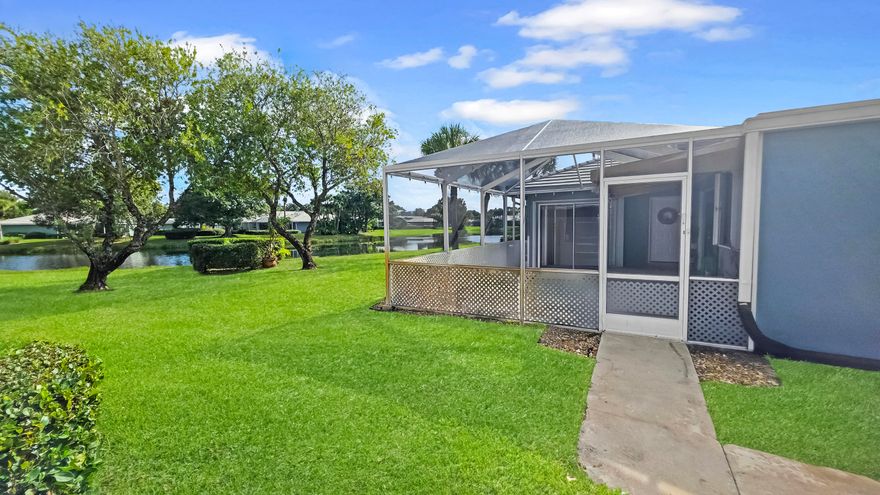 MOTIVATED SELLER!! Ask about assumable loan - 4.375% rate! Exterior freshly painted! Enjoy stunning LAKE VIEWS from the large screened patio with awning extension, accessible from both generously-sized bedrooms. Discover the perfect blend of comfort and style in this all-ages community! Minutes to I-95 and all the amenities St Lucie West has to offer! This single-story villa has an inviting open floor plan with vaulted ceilings. The split floor plan ensures privacy, with the guest bdrm featuring a versatile Murphy bed. Full-size washer/dryer in-unit PLUS extra storage room! Community amenities include a refreshing pool, tennis and pickleball courts, and a community room, providing endless recreation opportunities. HOA includes lawn care, basic cable, exterior maint/ins, roof AND internet!