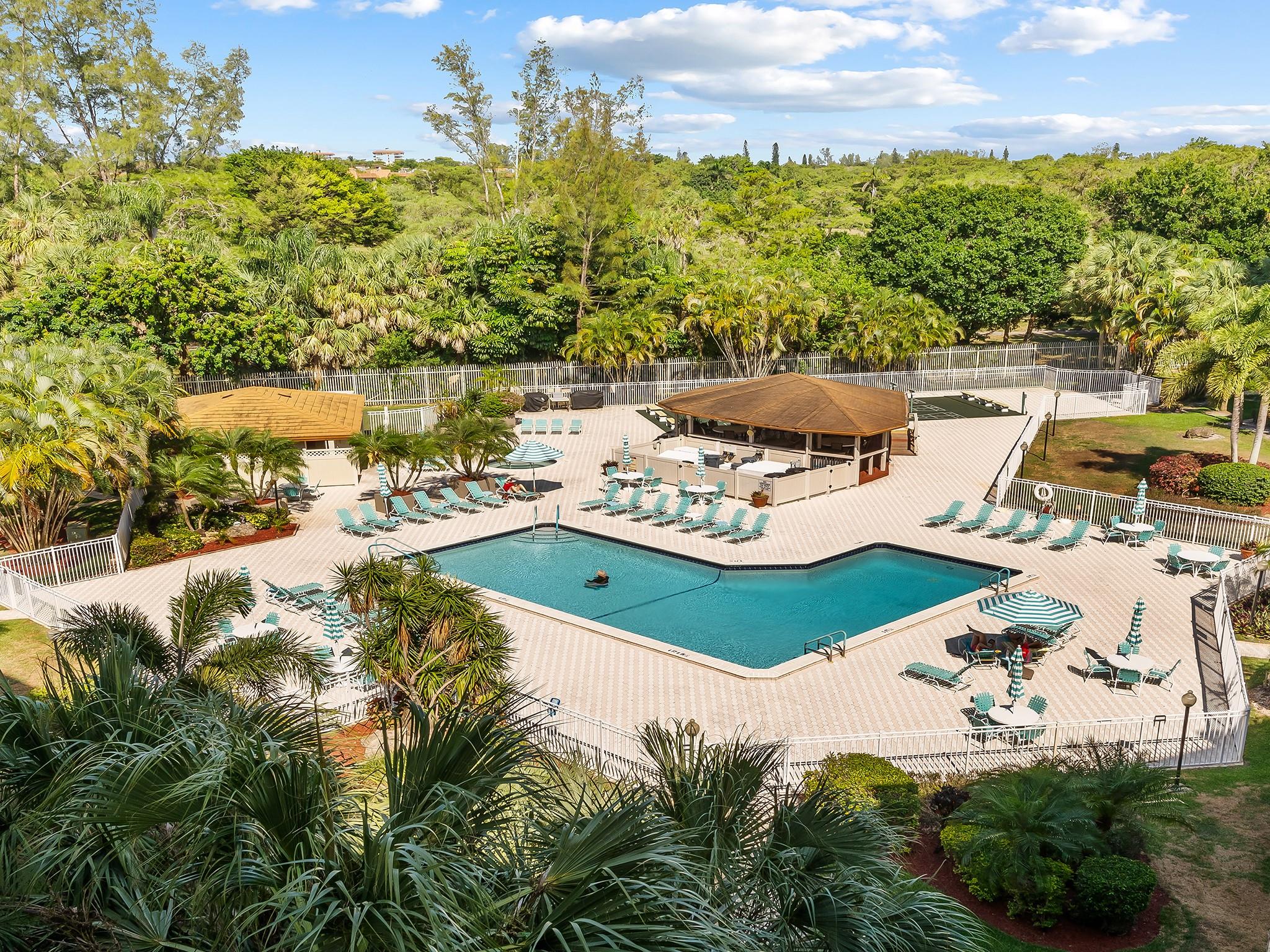 NEW PRICE!! Welcome to the charming 18th Hole, Unit 606D! This inviting 2-bedroom, 2-bath condo features a newer AC for ultimate year-round comfort. Start your day on your private screened balcony with serene pool views, and unwind in the spacious primary bedroom's cozy sitting area. Enjoy the convenience of an in-unit washer/dryer and a host of on-site amenities, including a barbecue area, tennis court, gym, and billiards room. With features like an elevator, bike room, and a manned security gate, every aspect of easy living is covered. Come and experience the warm appeal of 18th Hole, Unit 606D. Schedule a tour today and discover your dream home waiting just for you!