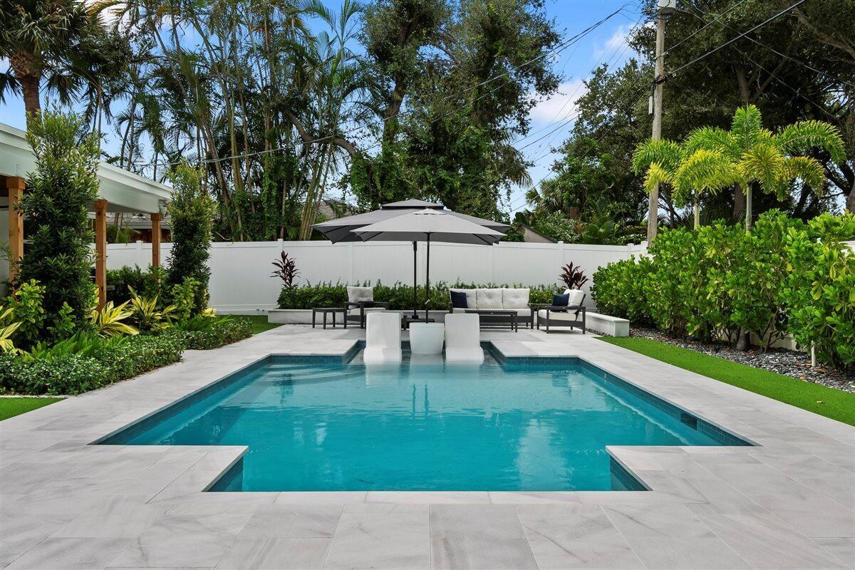 Season Rental - Available December 1, 2025 to March 31, 2026 Escape the cold and embrace the sun-drenched lifestyle of Jupiter, Florida where winter means warm breezes, clear skies, and endless outdoor adventure. This beautifully renovated 3-bedroom, 2-bath single-family home offers the ideal seasonal getaway, combining modern luxury with laid-back coastal charm in one of South Florida's most coveted destinations. Inside, the home welcomes you with an airy, open-concept design bathed in natural light. A stunning, fully updated kitchen features quartz countertops, stainless steel appliances, and ample space for casual mornings or festive holiday dinners. The spacious living and dining areas flow effortlessly into a lush, private backyard oasis, making indoor-outdoor living effortless.