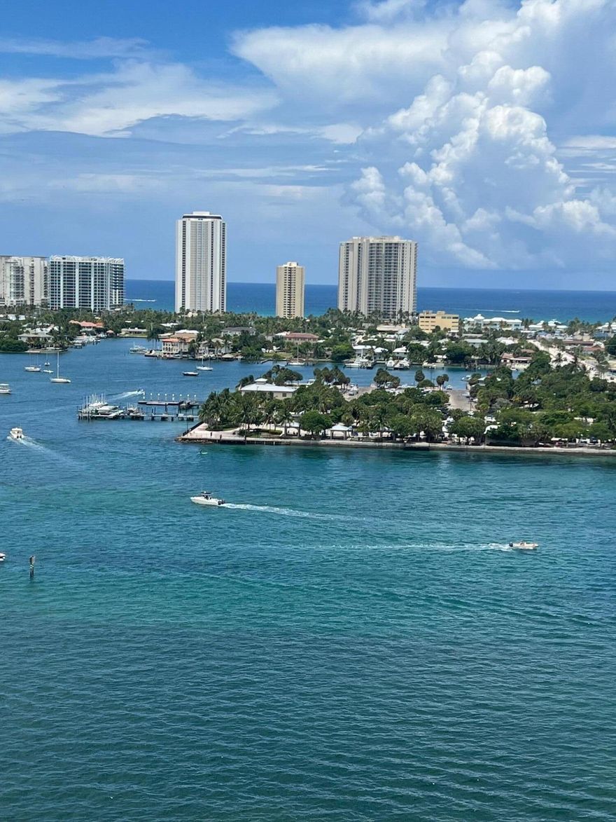 Stunning 18th-floor, east-facing residence in a premier waterfront tower community with breathtaking Intracoastal and Atlantic Ocean views. Enjoy exceptional privacy and spectacular sunrises from your private balcony through floor-to-ceiling impact glass sliders. This professionally renovated 3BR/3BA unit features all en-suite bedrooms and a desirable split floor plan. Interior upgrades include travertine flooring throughout, granite countertops, custom cabinetry, crown molding, and a neutral, move-in-ready design. Resort-style amenities include 24/7 manned gate, valet service, rooftop heated pool with panoramic coastal views, fitness center, sauna and steam rooms, social lounge with fireplace, clubhouse, billiards room, BBQ areas, wet bar, tennis and pickleball courts,   and climate-controlled storage. Adjacent full-service marina with dry docks. Direct ocean access with no fixed bridges—ideal for boaters. Pet-friendly community. Community-wide exterior painting project underway, enhancing the building's overall appearance and long-term value.