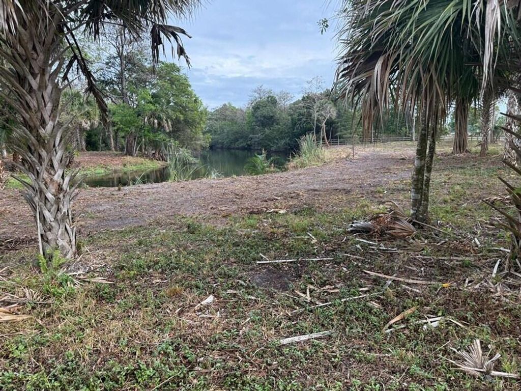 Photo of 14439 Collecting Canal Road, Loxahatchee Groves, FL 33470 (MLS # R11127450)