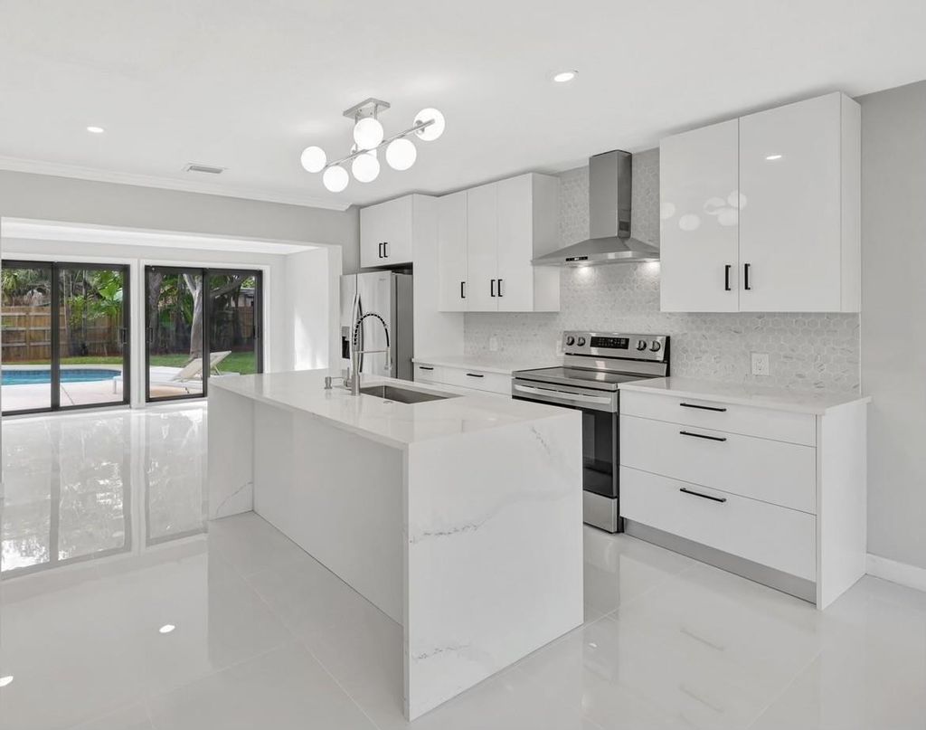 Photo of 1310 NE 42nd Street, Oakland Park, FL 33334 (MLS # F10486655)