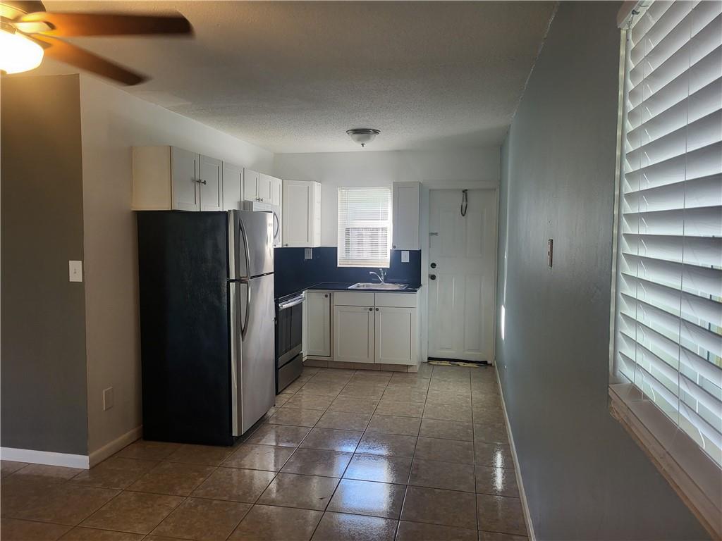 A pretty little Oasis surrounded by beautiful townhomes! So close to downtown, yet minutes to Wilton Dr, Riverwalk or I-95! Gated community, spacious bedroom, 1 bath with eat-in kitchen & little yard just off the kitchen. Stainless Steel appliances. Impact windows. Lots of light, back corner unit of a triplex. Large lush courtyard between buildings, with lovely foliage, very serene. Laundry on premises. Minimum Credit Score 670. $100 Application Fee. Speedy Approval. Must See!!!