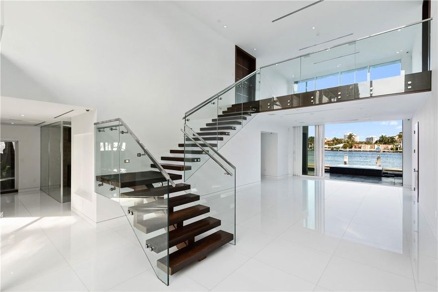 A work from home oasis. Zoom from a custom built office while enjoying the unparalleled views of boat activity on the 3 wide waterways. Unwind in your private gym, steam shower and cedar sauna. As winter forces others indoors, BBQ at the covered summer kitchen or spend time on a patio large enough to socially distance. Entertain in the center great room or climate-controlled wine room as caterers work in the oversized kitchen. The floor to ceiling windows of the second-floor loft is the ideal living room to enjoy a quiet read. Retire to the 1500sf master with oversized balcony, sitting area, his/her closets, wet bar and stunning bath. Feel safe - security patrols 24/7. As travel restrictions ease, at canal prices, this architecturally reviewed property on wide water will not last long.