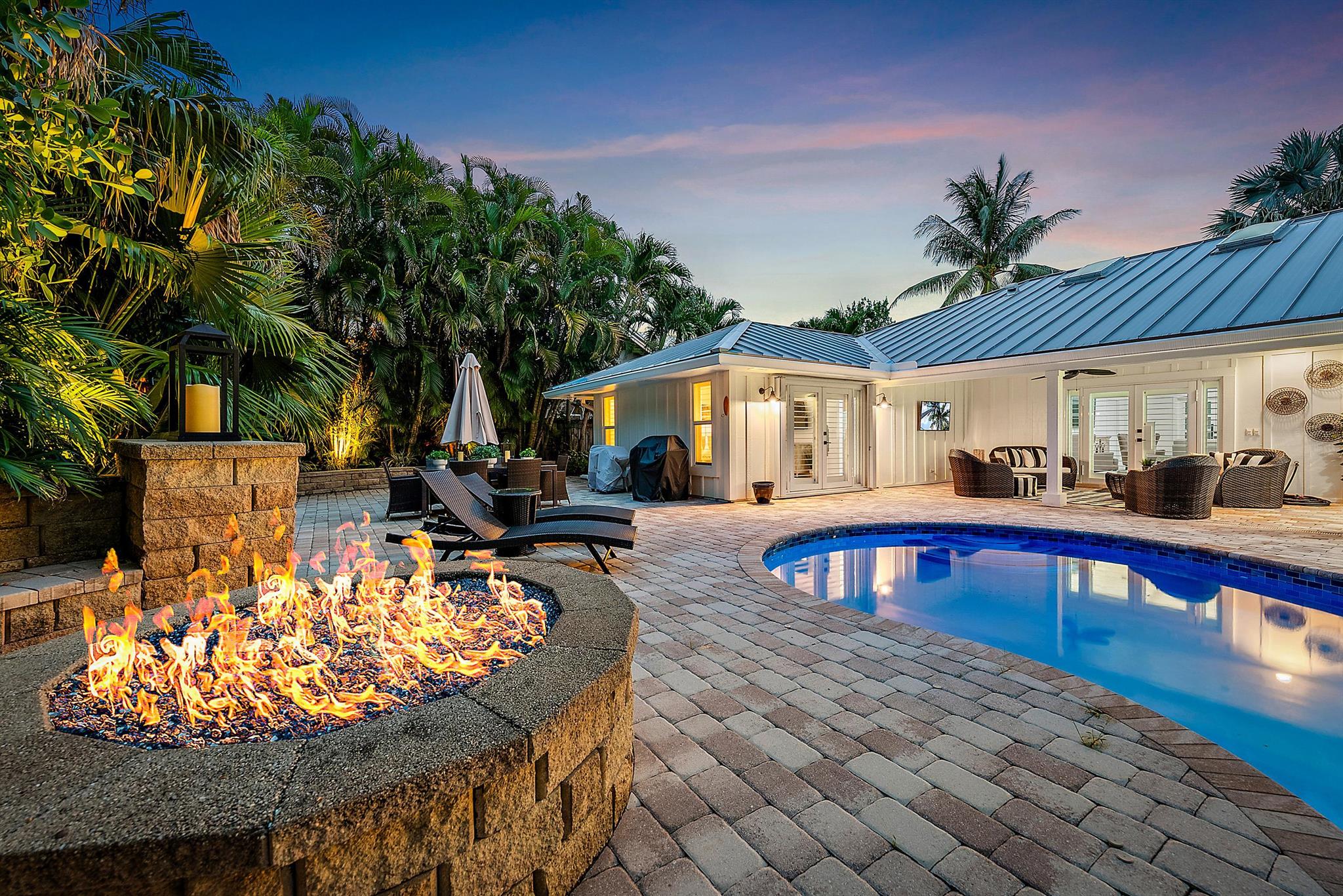 Just bring your bathing suit and toothbrush to this elegantly re-imagined, completely remodeled and furnished coastal inspired beach escape. This homes transformation was focused on opening the space and transforming the home to a elegant beach retreat.  The new living area includes a vaulted family room with shiplap, beam ceilings, and board and a batten focal wall . A large designer kitchen with custom micro shaker cabinetry was designed by Zimmermans kitchens. The beautiful, expansive island with luxury appliances and quartz counters makes perfect for entertaining and family gatherings.  The Primary suite was redesigned with a larger bathroom and closet area. The spa-like bathroom is an oasis with a luxurious shower, a free-standing soaker tub, upgraded fixtures and vanity.