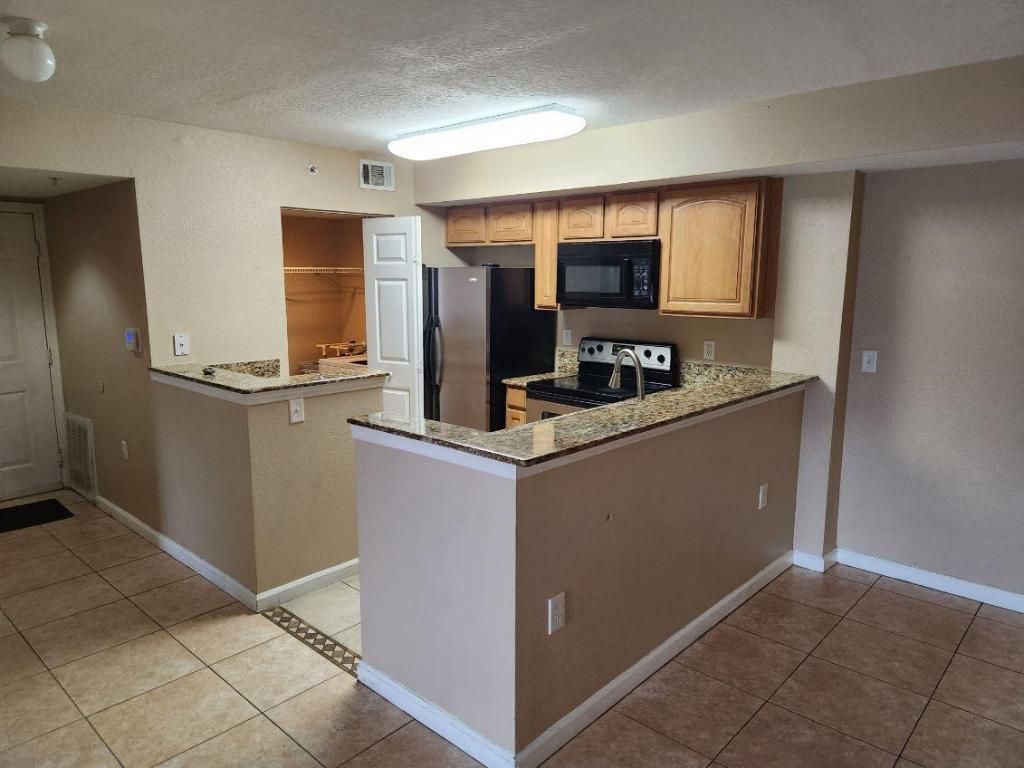 Photo of 211 SW Palm Drive #105, Port Saint Lucie, FL 34986 (MLS # R10933625)