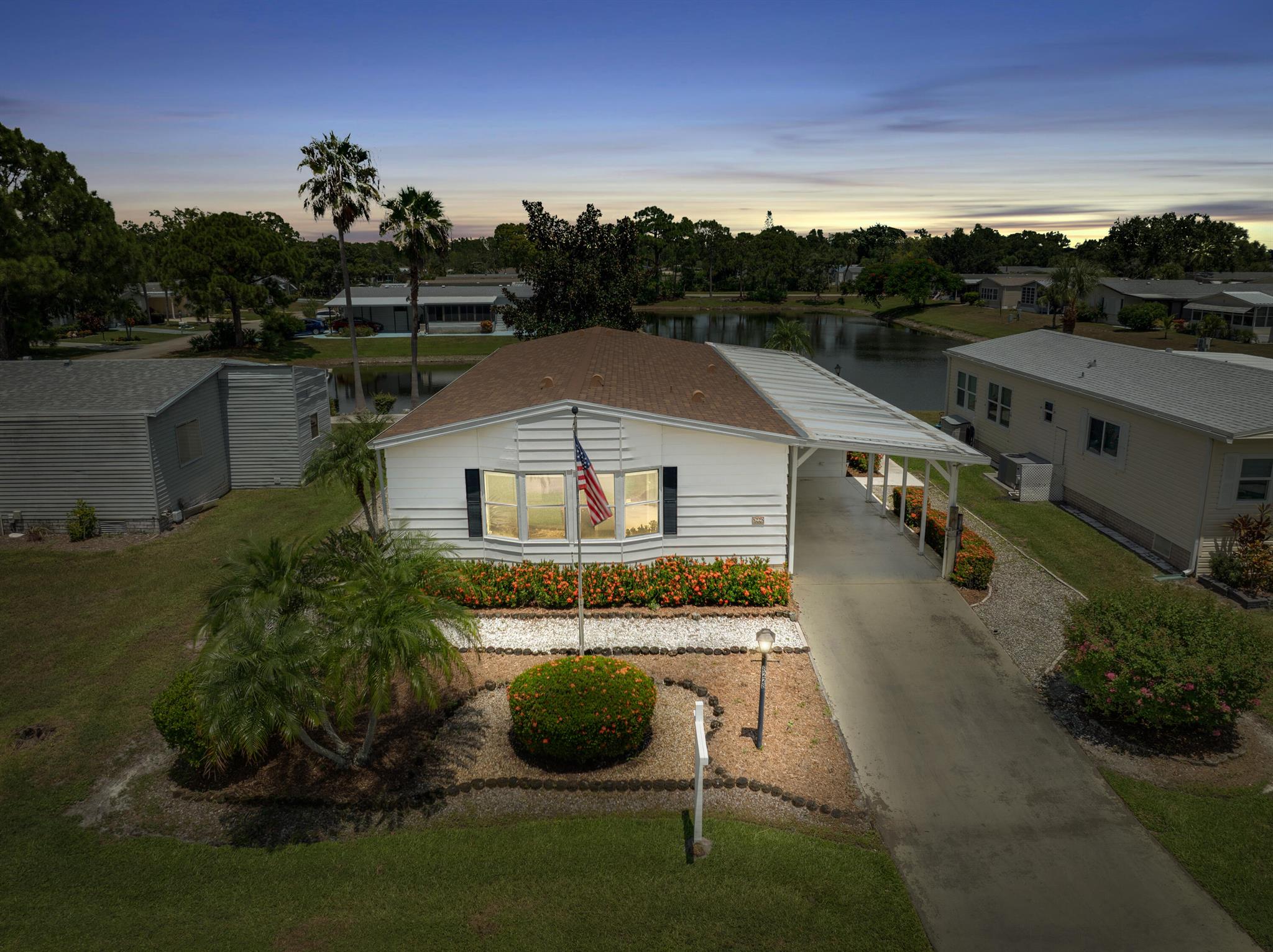 Expansive 2-bedroom, 2-bath LAND OWNED home with a den area offering serene pond views and spacious living in the highly sought-after Savanna Club community. The residence features a brand new roof 2024, A/C 2022, new carpeting in primary bedroom and living/dining area 2025, and a new washer/dryer 2025. Enjoy cooking and entertaining in the large kitchen with a center island. The open-concept living and dining room are lined with windows to take full advantage of the incredible water view. Home even has an electric wheel chair lift (or stairs) for easy access to the house and the backyard patio. Savanna Club is an active community with 3 clubhouses, 3 pools, 3 fitness centers, theater, on-site restaurant, and an 18-hole golf course with other amenities including a full calendar of events.