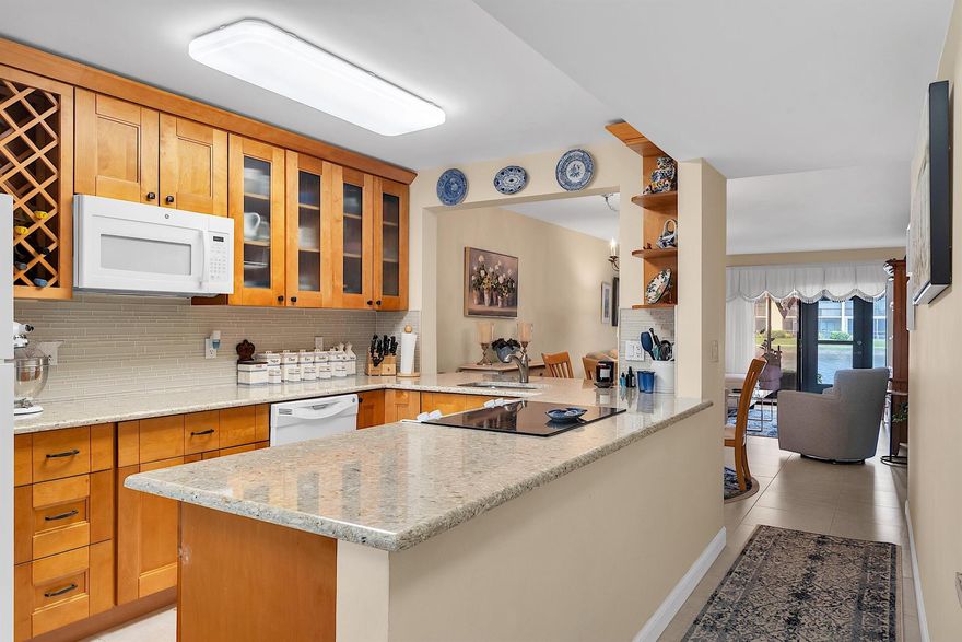 CATCH THE BREEZE AS YOU RELAX IN YOUR ENCLOSED LANAI ON THE LAKE. VIEWS FROM MASTER BEDROOM, LIVING ROOM, KITCHEN ETC. THIS LIGHT AND BRIGHT RARELY AVAILABLE CORNER UNIT FEATURES A BEAUTIFUL OPEN KITCHEN PERFECTLY UPGRADED WITH GRANITE AND TON OF STORAGE FOR THE CHEF IN THE FAMILY. YOU'LL THOROUGHLY ENJOY THIS SPLIT PLAN CONDO WITH WALK-IN CLOSETS IN BOTH BEDROOMS. FORM YOUR UNIT IT'S AN EASY WALK TO THE HEATED/CHILLED POOL OR MOVE ON OVER TO THE MAIN CLUBHOUSE WITH SAUNA, SPA, LIBRARY, BILLARDS EXERSIZE ROOM AND JUST OUTSIDE YOU'LL FIND BOCCE, TENNIS, PICKLEBALL AND A GREAT WALKING PATH! SHOPPING IS JUST AT THE CORNER AND NEAR THE TURNPIKE TOO. STRAIGHT DOWN LAKE WORTH ROAD AND YOU'LL HIT QUIRKY LAKE WORTH AND IT'S BEAUTIFUL BEACH. A/C AND WATER HEATER 2019, ROOF 2023.