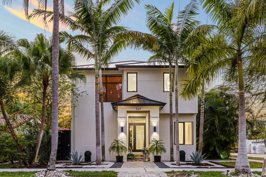 5-bed, 5-bath CBS corner home in Victoria Park, Fort Lauderdale, under 1/4 acre, no HOA. This 3,880 sq ft two-story built in 2019 features 20' ceilings, marble and tile floors, open kitchen with gas range, wall oven, custom cabinetry, and island overlooking the family room and pool. Primary suite upstairs with sitting area, dual sinks, and separate shower. Two laundry rooms with 3 washers and 3 dryers. Full impact glass, metal roof, gas tankless water heater, whole-house water softener, filtered drinking water, motorized blinds, Sonos, owned alarm and camera system, EV charger, and saltwater pool. Walking distance to Holiday Park, Las Olas, restaurants, and shops. Minutes to Downtown, Brightline, and Fort Lauderdale International Airport.