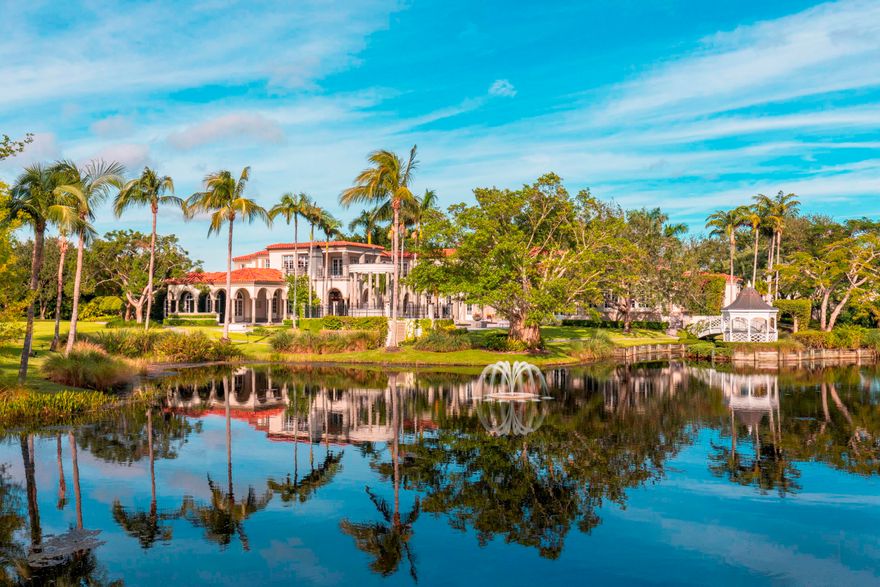 SELLER WILL PAY THE REQUIRED ASSOCIATION 1.5% IMPACT FEE AT CLOSING. The perfect combination of price and value make this Le Lac estate the best offering in Boca Raton this season. Designed by Randall Stofft with exceptional attention to detail and using elegant imported materials the home blends dramatic architecture and craftsmanship to create a truly uncommon haven of total privacy and seclusion. Conveniently poised in central Boca only moments to the boutiques and restaurants of Boca Raton and Delray Beach this magnificent home exudes a grand and elegant style. Sited on a rare 6.65 acres the entrance to the estate is enhanced by stately wrought-iron gates reveling a large circular driveway and Porte Cochere with garages for six cars. The Estate features 23,902 total square feet, of elegance, 9 BR and 8.4BA, grand living room, formal dining room, and a climate control wine cellar capable of holding the most discerning sommelier collection.  The extensive and well-orchestrated gourmet kitchens, with luxurious professional appliances provide the perfect opportunity for hosting small and large gatherings. In addition, the main floor includes a large family room, breakfast room, media/movie center with theater-style seating and cutting edge projector, a two level library with fireplace and mahogany shelving. Tucked away in the south end providing the owner a sanctuary is a sumptuous ground floor master suite with separate siting room, Zen like bath with outdoor Balinese style shower, walk in closets with built in cabinetry, a private balcony just steps  to a bridge that connects to a charming  gazebo completing the retreat like setting. . The sunlit second floor boasts four significant guest suites with sitting areas, a play room with access to a balcony overlooking the breathtaking private lake and gardens. The drama continues with the ingeniously landscaped grounds filled with unexpected textures and appealing lighted walking paths. A private lake, two separate guest houses, Har-Tru clay tennis court, state of the art gym, an awe inspiring pool area with elevated spa encircled by stone pillars and waterfall seamless integrated with a cozy loggia and fireplace. Warm and inviting, refined and casual all describe this exquisite Estate which is fairytale in sight and price...Sure to exhilarate all who visit.