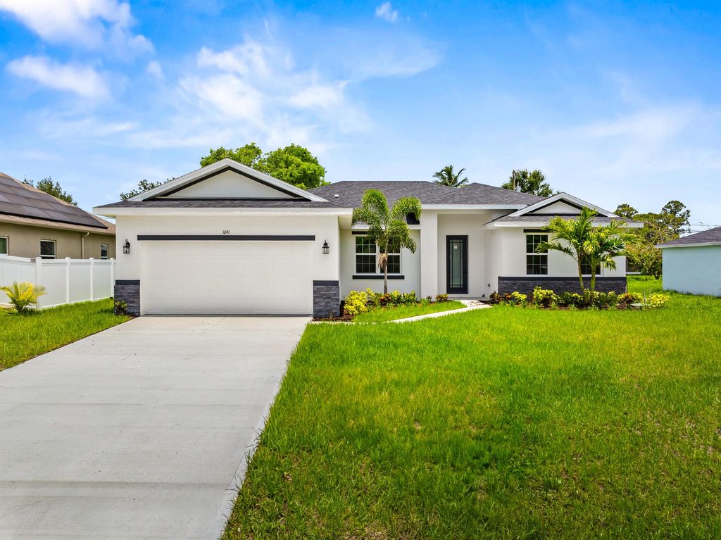 Photo of 1641 SW Rutland Street, Port Saint Lucie, FL 34987 (MLS # R11072987)