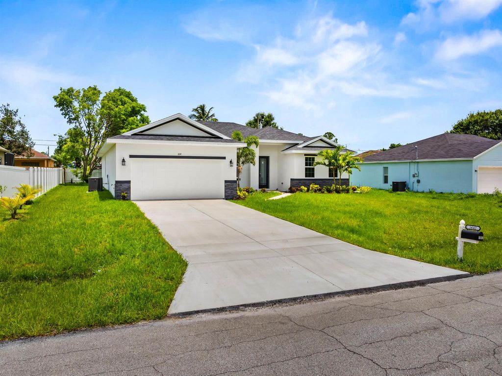 Photo of 1641 SW Rutland Street, Port Saint Lucie, FL 34987 (MLS # R11072987)