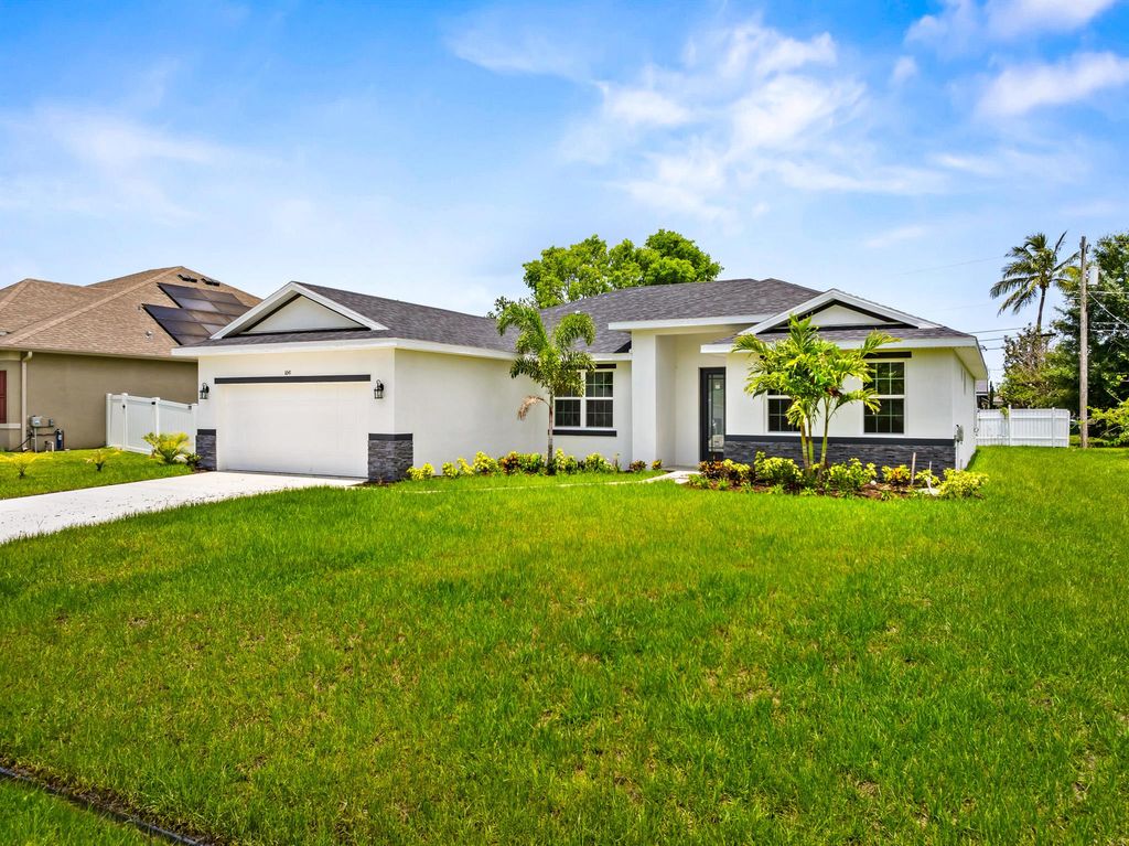 Photo of 1641 SW Rutland Street, Port Saint Lucie, FL 34987 (MLS # R11072987)