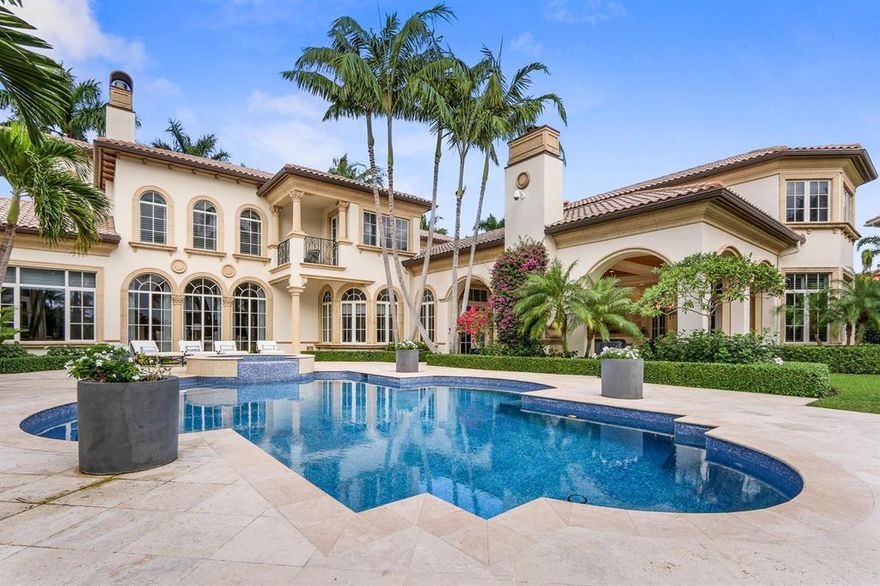 Exquisite modern mediterranean home on rare double lot in North Palm's premiere boating community! This palatial residence (9,700+ sf) is set behind manicured privacy hedges along a grand circular flagstone driveway. Interiors are renovated to perfection - bright and airy. Views are dramatic & gorgeous! Inviting foyer leads to naturally light filled living areas which are both elegant & comfortably relaxed. True chef's kitchen w/Viking appliances, Huge butlers pantry + wine fridge. Master BR suite on lower level offers sumptuous luxury, spa bath, extravagant closets! Outdoor covered loggia w/ gas fireplace & bar is perfect for entertaining. Gym, office, luxe theater. Crestron lighting, 4 car garage w/room for 6! Natural gas, 2 laundry rooms, generator. Easy ICW access - docks 2 boats!