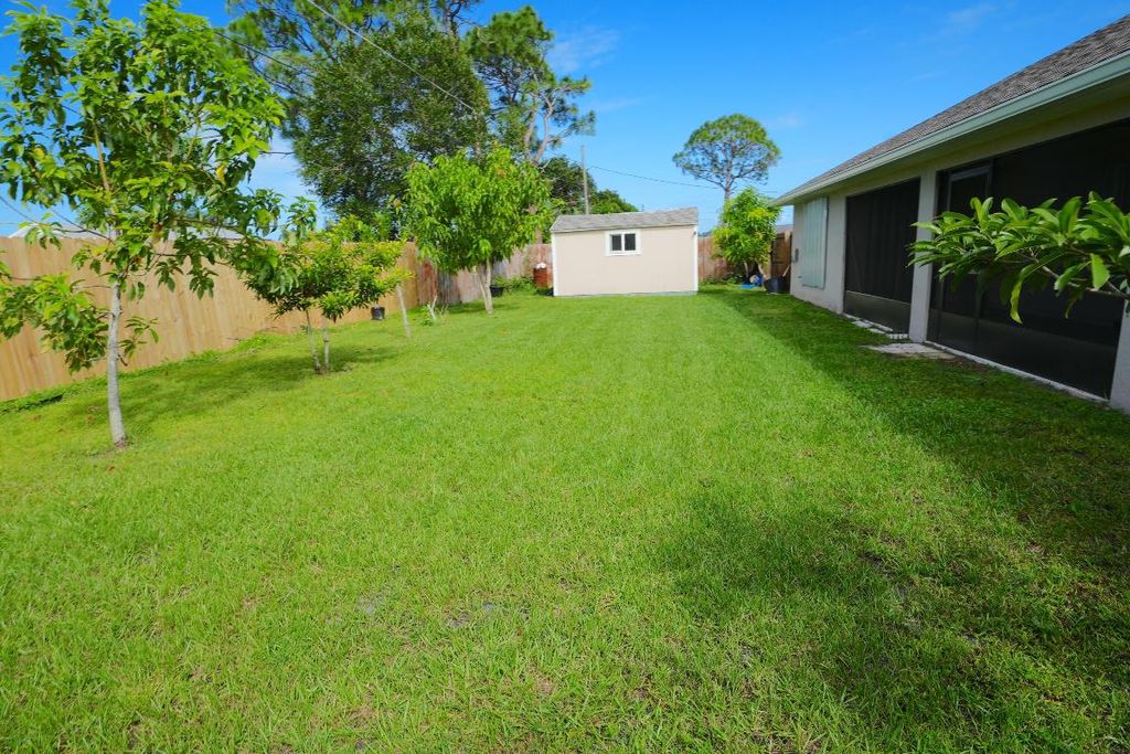Photo of 2112 SE Holland Street, Port Saint Lucie, FL 34952 (MLS # R11032579)