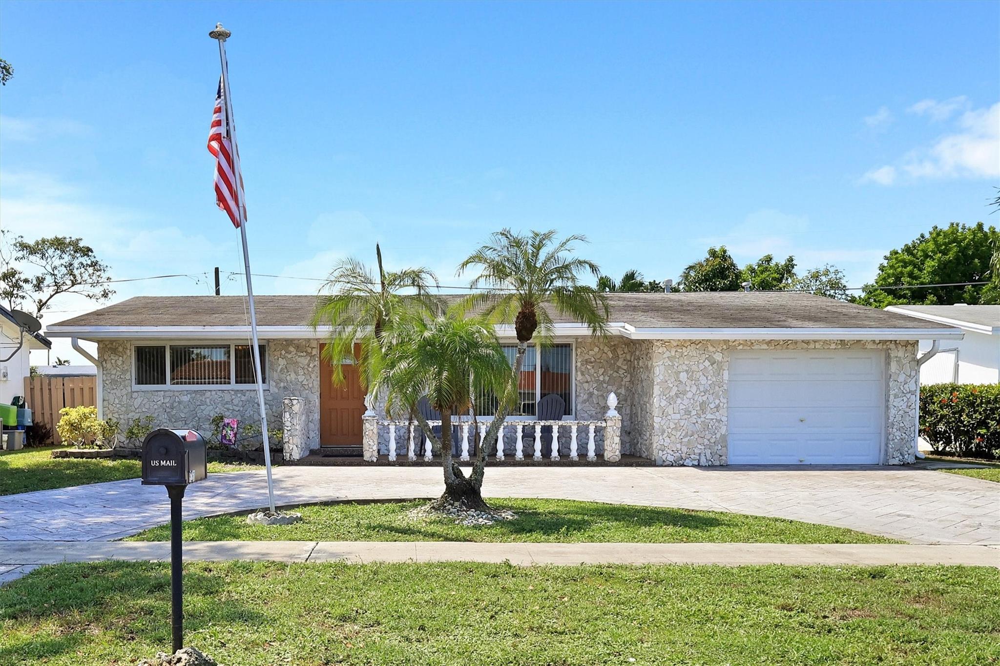 Single Family House with a great layout – 2 bedroom, 2 bath home with a one car garage in one of Sunrise’s prime neighborhoods with no HOA. Bedrooms are very nice size with a walk-in closet in the main bedroom. The hallway bath has been totally updated with beautiful finishes. Impact windows on the front of the house and one bathroom. Featuring a shingle roof (approx. 18 years old). The kitchen has new s!s appliances. New A/C in June of 2023. Large living area & formal dining. Very large kitchen with dinette area. Home has a huge 30"X10' enclosed porch/family room. Large back yard with plenty of room for a pool. Circular stamped concrete driveway with room enough for several cars for those special occasions. Come see and then put your special touches on this home to make it your own.