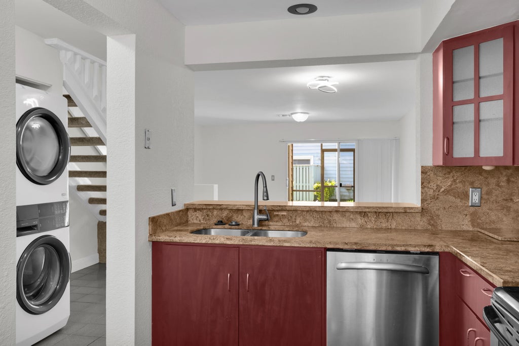 Photo of 2164 CHAMPIONS Way, North Lauderdale, FL 33068 (MLS # B26082251)