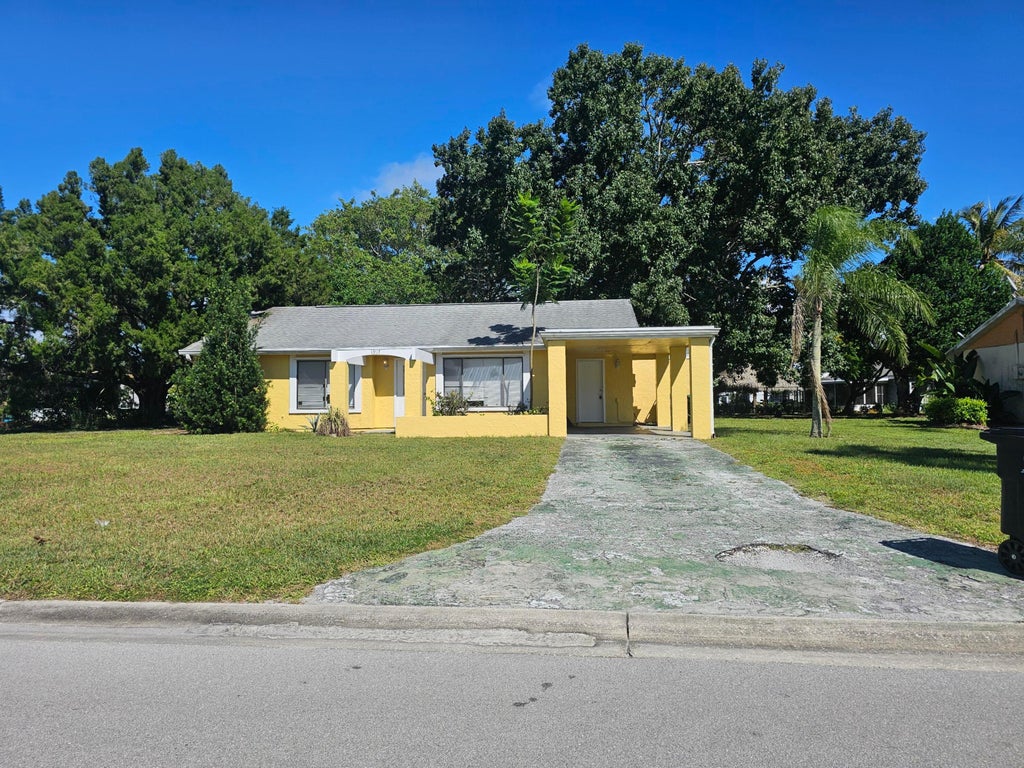 Photo of 1917 SE Burgundy Lane, Port Saint Lucie, FL 34952 (MLS # B26064006)