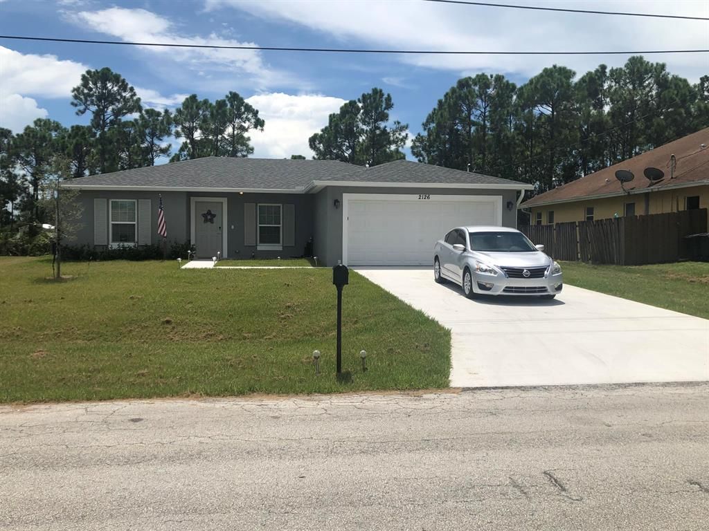 Photo of 2126 SW Biella Avenue, Port Saint Lucie, FL 34953 (MLS # R10825204)