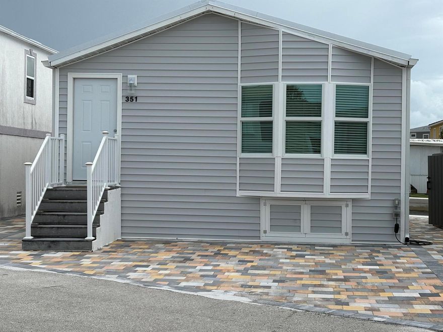 A boater's dream awaits in this updated waterfront home on Nettles Island in Jensen Beach. With views of the Intracoastal Waterway/Indian River, this property offers the ultimate Florida resort lifestyle.Property featuresWaterfront access: A new seawall is already in place, giving you the opportunity to add a boat lift and dock for direct access to the Intracoastal.This home is essentially new from the outside in. Enjoy peace of mind with a new metal roof, impact windows, and modern siding.The interior offers 2 bedrooms and 2 full baths with an open-concept living area is bright and spacious, perfect for entertaining or relaxing. The home features all-new appliances throughout.New pavers enhance the curb appeal and create the perfect outdoor space for relaxing or dining.