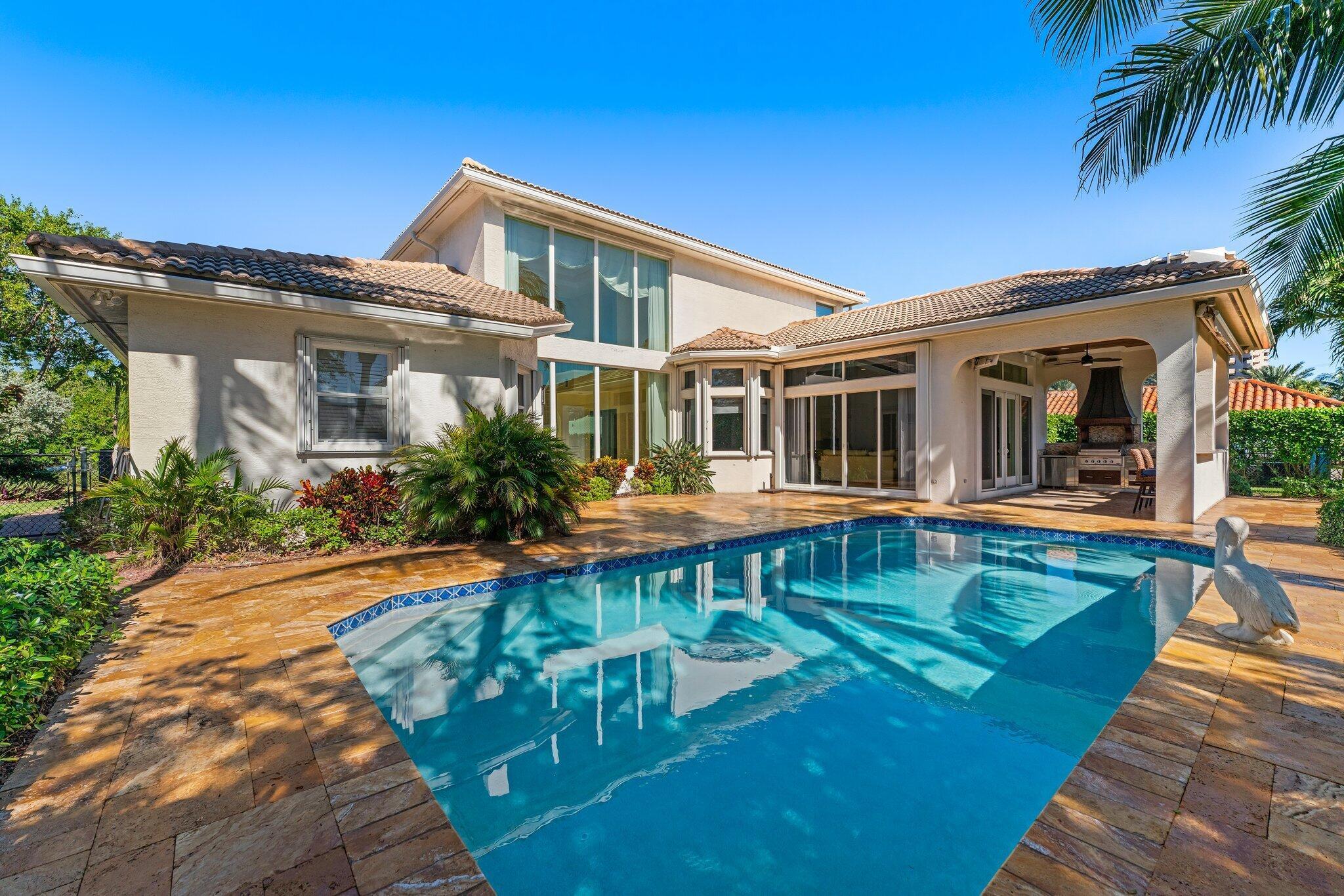 Welcome to 1231 Pine Point Rd, an exceptional fully furnished Mediterranean-style coastal retreat on one of Singer Island's most sought-after streets. This home offers 4 bedrooms, 3 bathrooms, a 2-car garage, and a pool, all just a short stroll from the island's pristine beaches. The private upstairs master suite boasts two walk-in closets and a spacious bath, while three additional bedrooms are located on the main level. Step inside and be captivated by soaring ceilings, abundant natural light, and impeccable design. The 2022-renovated chef's kitchen features Viking appliances, a 48'' refrigerator, 5-burner gas stove, wine fridge, quartz countertops, custom cabinetry with organizers, and over/under-cabinet lighting. Enjoy coastal living near beaches, dining, and golf.