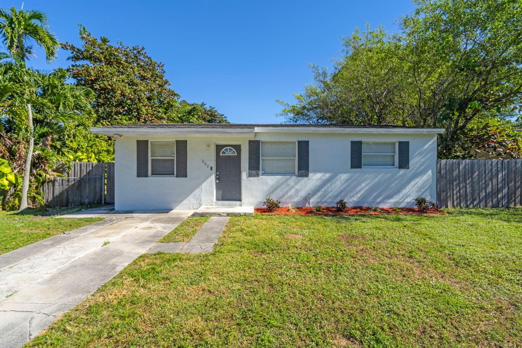 Photo of 880 NW 33rd Terrace NW, Lauderhill, FL 33311 (MLS # B26091604)