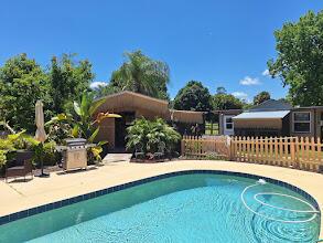 TROPICAL PARADISE-1 OF A KIND! TURN-KEY =HORSES AG EQUESTRIAN CERT. REHAB BOARDING, EQUINE ASSISTED THERAPY FACILITY OR EXOTICS. ON QUIET DEAD END. SMALL UPDATED 2/2 HOME. THIS PLACE HAS ALL THE BELLS & WHISTLES! 22KW NEW STANDY GENERATOR W UNDERGROUND PROPANE 500TANK, 5 STALL BARN, TIKI CABANA, FEED ROOM, TACK ROOM, SMALL RING GREAT FOOTING , PADDOCKS FENCED & CROSS FENCED, SEVERAL EXTRA OUTBUILDINGS & SEVERAL SCREEN/WIRE ENCLOSURES. NEW ROOF 2024, SALT GEN. DIAMOND BRITE POOL. UPDATED WATER SYSTM, ELECTRIC, APPLIANCES. TRAILER PARKING LOT, RV +30A HOOK UP W SEPTIC, AUTO COMMERCIAL GATE OPENER, ADT SECURITY, STORM SHELTER/ STORAGE WITH MINI SPLIT,WORKSHOP, COVERED WASH STALLS, PASTURE STALLS, ALL OPENS HAVE SHUTTERS, UPDATED DRAIN FIELD & SEPTIC RECENT PUMP2025, 2017 AC WITH RECENT IN