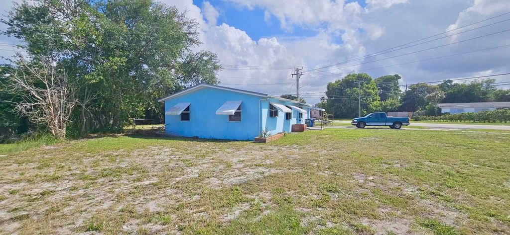 Photo of 860 W Jasmine Drive, Lake Park, FL 33403 (MLS # B26024553)
