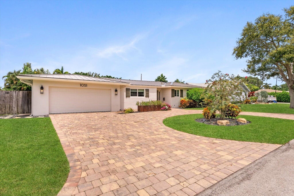 Photo of 1051 NW 3rd Street, Boca Raton, FL 33486 (MLS # B26071328)