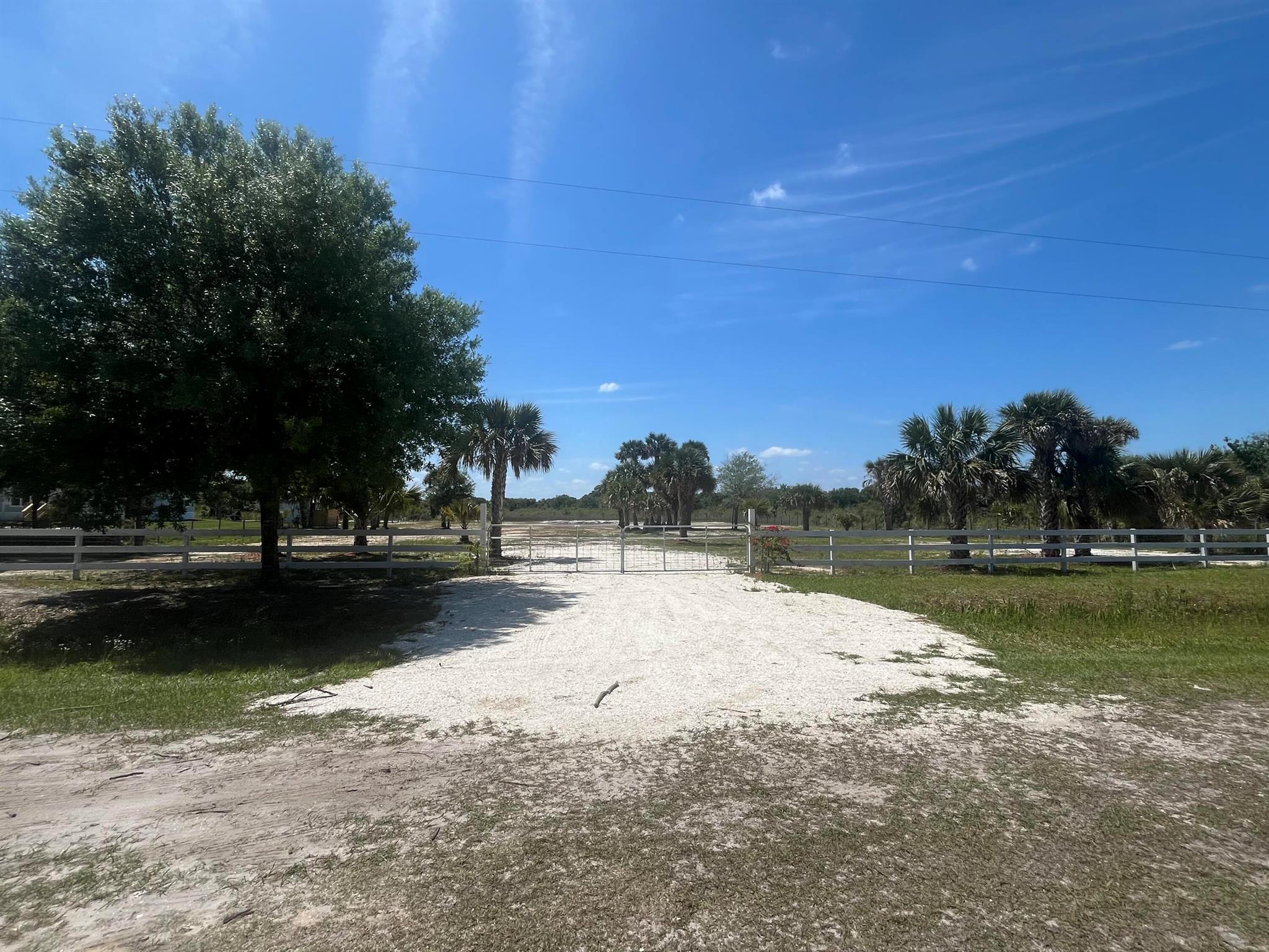 Build or bring your dream home on this spacious 1.25-acre lot just off of the main dirt road but yet still private. power poles on this street making it easy to connect to power. This property is cleared, fenced with a gate and culvert already in place. Residents can enjoy the privacy of a rural setting while still being close to essential amenities. The area is a haven for outdoor enthusiasts, boasting attractions like the Kissimmee River Preserve State Park and the expansive Lake Okeechobee, famous for its excellent fishing opportunities. Whether it's fishing, hunting, agriculture, or simply a desire for privacy, Okeechobee County provides an idyllic backdrop to create a personalized retreat.